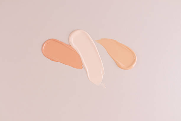 istock samples of liquid foundation powder in a different tones on a beige background. top view. Layout for product design. A copy space. mockup. 2162081204