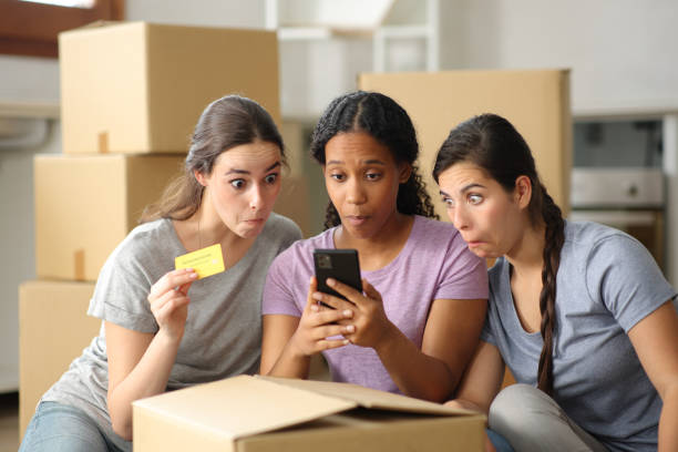 istock Perplexed roommates buying online moving house 2162081434