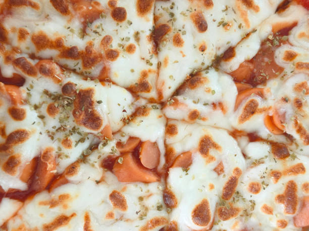 Close up Italian pizza with mozzarella and sausage topping.
