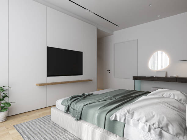 istock The modern bedroom features a white wall and a hardwood floor. 2162083271