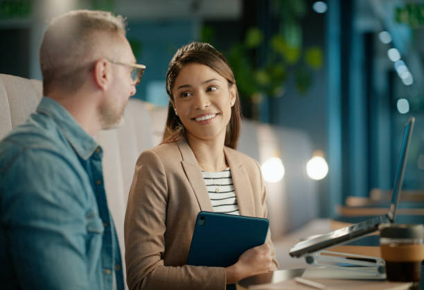 istock Teamwork, night or business people with laptop feedback for networking, blog or email in office. Late, diversity or employees speaking of news on article post or report update for research planning 2162083712