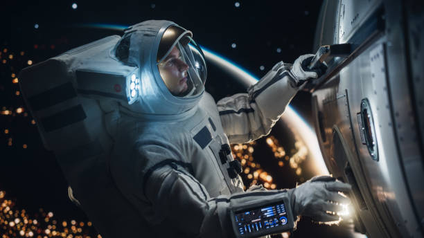 istock Space Engineer Servicing a Panel on a Communication Satellite. Brave Caucasian Male Astronaut Working in Outer Space with Beautiful Dark Side of Planet Earth in the Background 2162084317