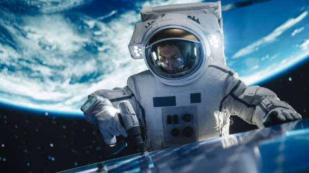 istock Professional Astronaut Servicing a Solar Electric Panel Outside of a Spacecraft on a Routine Maintenance Check in Outer Space. Space Technology, Sustainable Green Energy, and Exploration Concept 2162084376