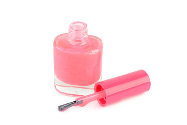 Pink nail polish isolated on white background.