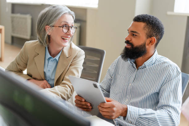 istock Business people having a meeting discussing work on a tablet, teamwork concept 2162085380
