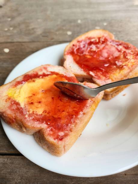 Slice toast bread with strawberry jam and butter
