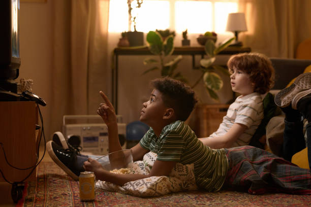 Two Boys Watching TV Show at Home