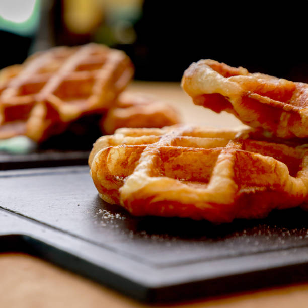 istock Belgian waffles close-up isolated on black background. Home made. 2162086702