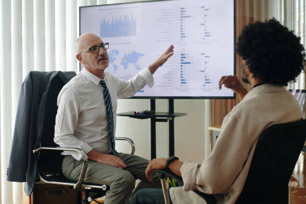 istock Marketers Discussing Charts At Meeting 2162087075