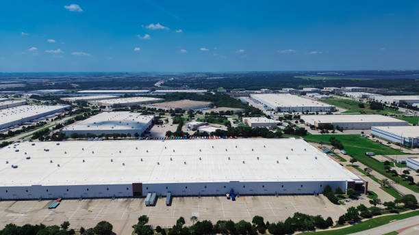 istock Fulfilment center and logistic complex in master planned industrial zone, modern warehouse, busy shipping container load unload semi-trailer truck, industrial zone suburb of Flower Mound, Texas 2162089376