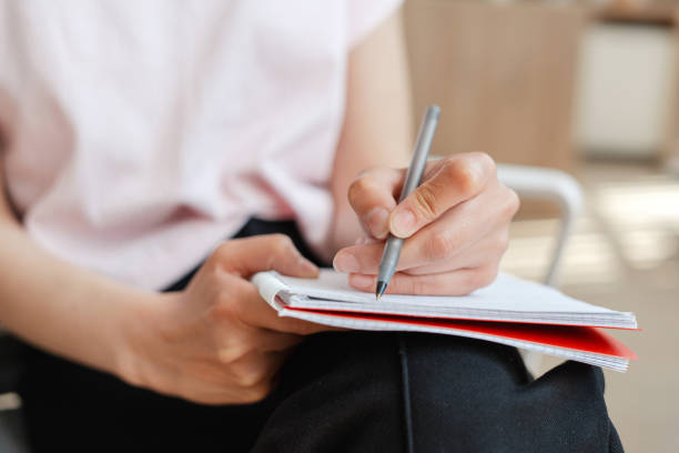 istock Woman taking notes in meeting at office, selective focus 2162089655