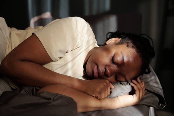 istock Young depressed woman lying on bed 2162090549