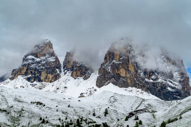 Dolomites mountain range at dusk, around Colac-Buffaure subgroup that forms part of the Marmolada group, Trentino, Italy in winter season with snow