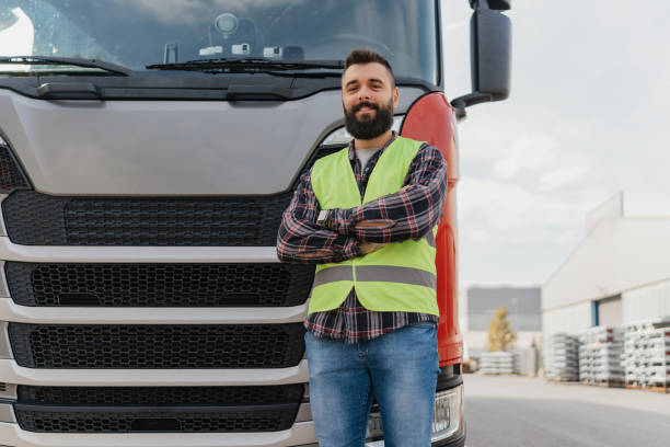 istock Truck driver standing confidently with folded arms 2162094486