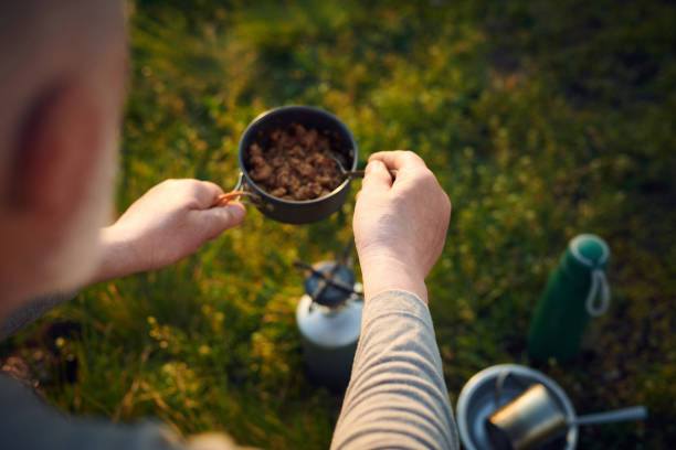 istock Unrecognizable Tourist Cooking Meal 2162094953