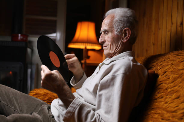 istock An elderly man listens to vinyl records. 2162095229