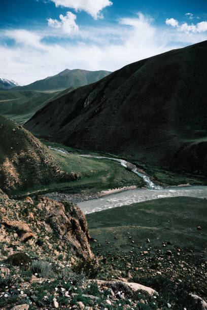 istock Two mountain rivers merge in green summer canyon 2162098523