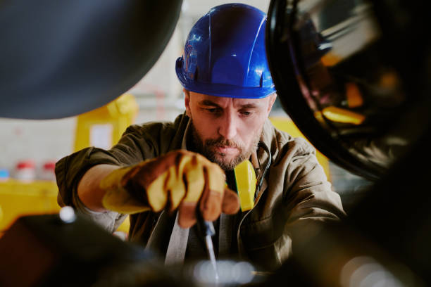 istock Bearded Technician Repairing Industrial Equipment 2162099447