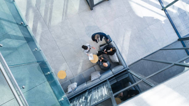 istock Business people, above and teamwork in office with collaboration, financial pitch with document for strategy. High angle, tax accountant and table meeting with budget paper for economy in building 2162101485