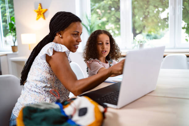 istock Mother and daughter Black ethnicity doing the homework together 2162101543