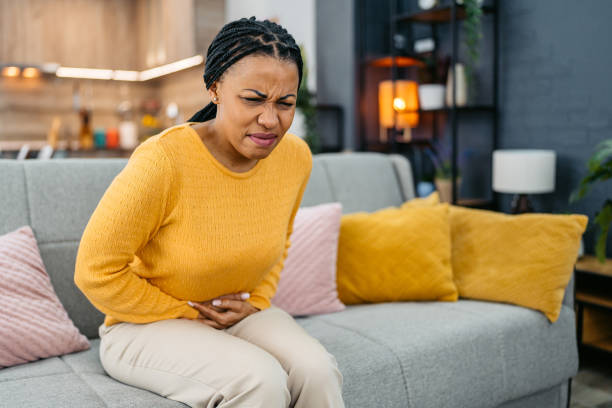 istock Young Woman Having Stomachache At Home 2162102686