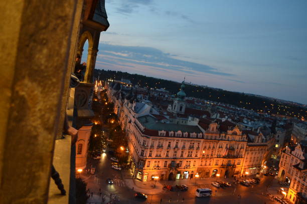 Prague - The City with the Church of Our Lady before Týn and Castle with the Cathedral in the background at dusk.