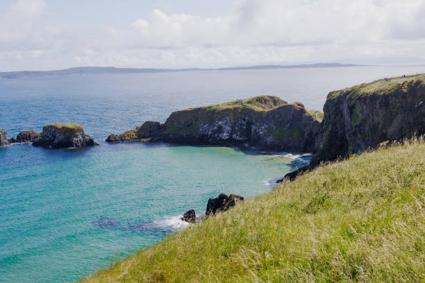 cliff along the rocky shoreline near the Carrick-A-Rede Rope Bridge