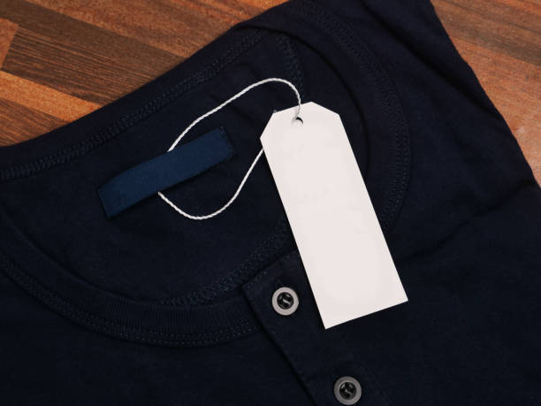 istock Blank white tag template on black henley shirt 2162108370