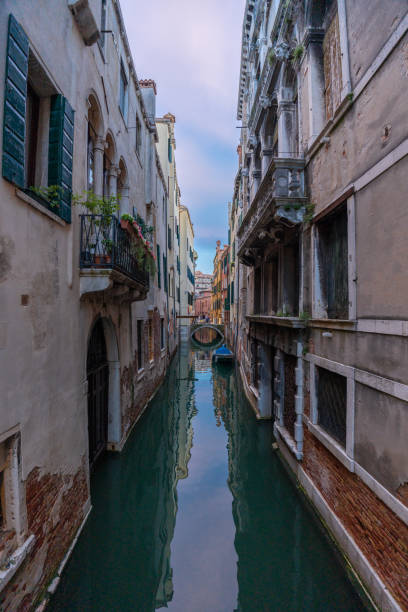 istock Peaceful Venice Canal Framed by Colorful Buildings. 2162109748