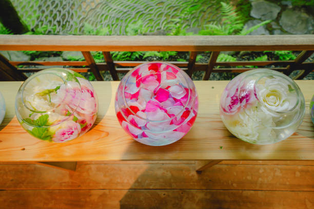 Red petals floating in green bowl