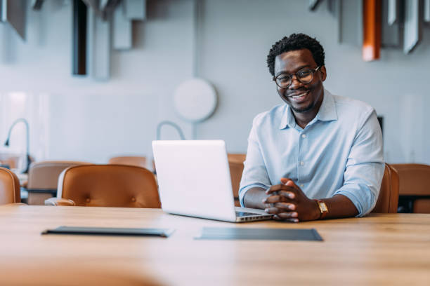 istock Successful businessman in modern office working on laptop. 2162112719