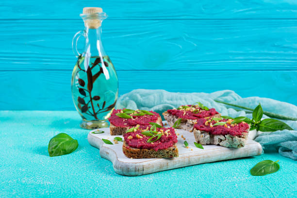 istock Toasts with beetroot, chopped nuts and herbs. Vegan bruschetta with beet 2162113146