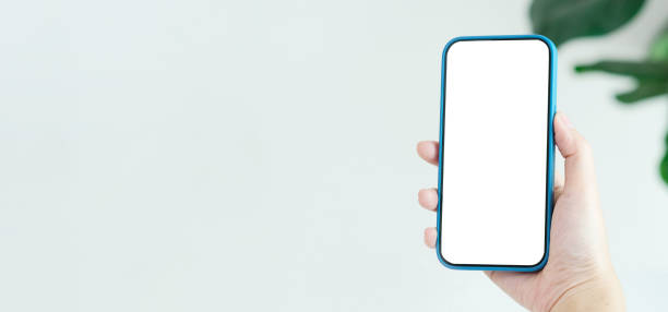 istock Woman hand holding black smart phone with blank screen for mock up with copy space, template, technology and lifestyle 2162114346