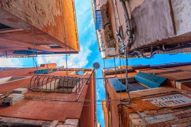 istock Skyline Framed by Venetian Buildings. Bottom to top view. 2162114495