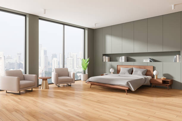 istock Stylish hotel bedroom interior with bed and armchairs, panoramic window 2162115366