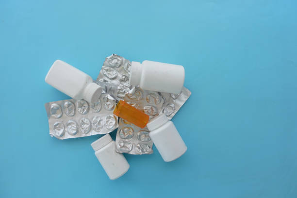 Close up of pills of blister pack on table .
