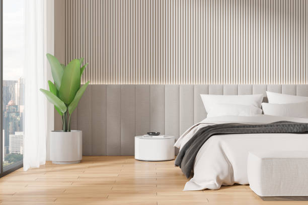 istock Modern bedroom with a gray headboard, potted plant, minimalist side table, floor to ceiling window. Light gray wall panels. Concept of interior design.  3D Rendering 2162116837