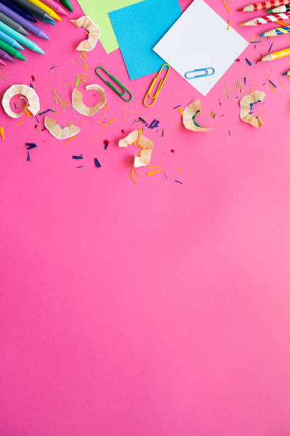 istock School supplies on a pink background with copy space. Back to school concept. 2162117294