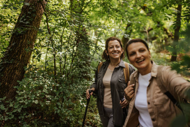 istock Two women taking a selfie during a forest hike 2162117300