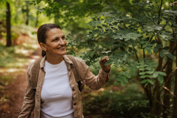 istock Woman enjoying the greenery on a hiking trail alone 2162117870