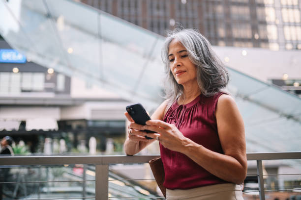 istock Commuter checking schedule on the phone while entering subway in DTLA 2162118720