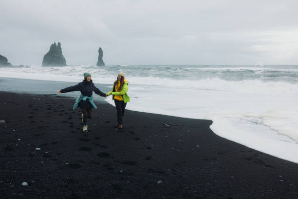 istock Freedom and Happiness Together to Explore Majestic Black Sand Beach 2162118914