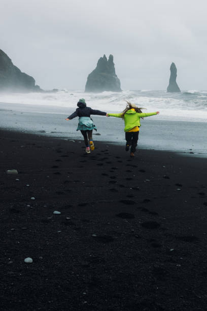 istock Freedom and Happiness Together to Explore Majestic Black Sand Beach 2162118978