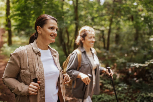 istock On a nature forest hike with smiles and hiking poles 2162119786