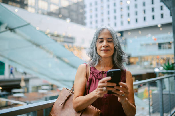 istock Commuter checking schedule on the phone while entering subway in DTLA 2162120594
