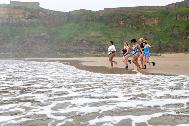 istock Running Into The Sea 2162120933