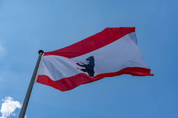 istock A red and white flag with a bear on it is flying in the sky 2162123240