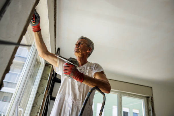 istock Mature man renovating walls after changing windows 2162124017