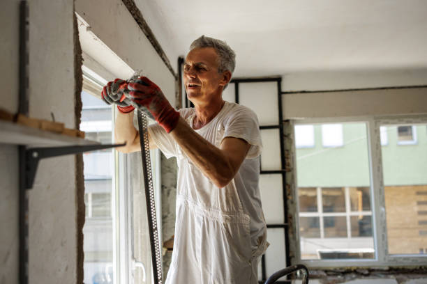 istock Smiling man renovating apartment 2162124029