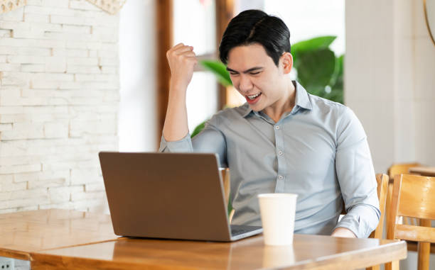 istock Young business man working at a coffee shop 2162126630